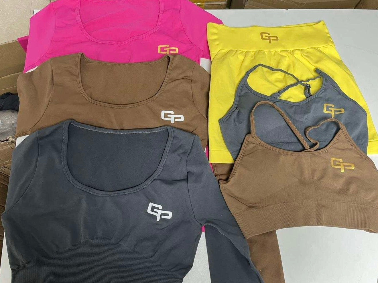 GP bright pink long-sleeve crop top and matching high-waisted shorts.